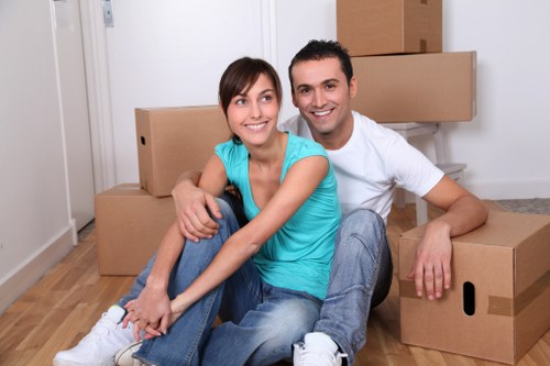 Professional removals team handling furniture in Cranham