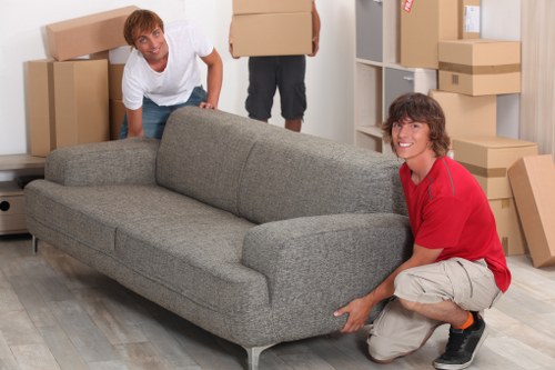 Boxes, furniture, and business items arranged in storage in Cranham